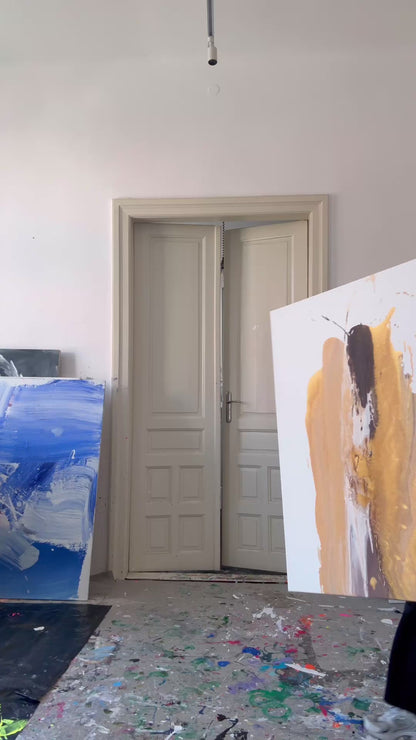 Abstract painting on canvas in shades of beige, gold, and dark brown